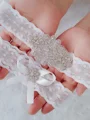 Sjarmerende brude/feminin blonde med rhinestone strømpebånd